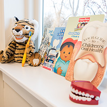children's books and tiger with teeth and toothbrush